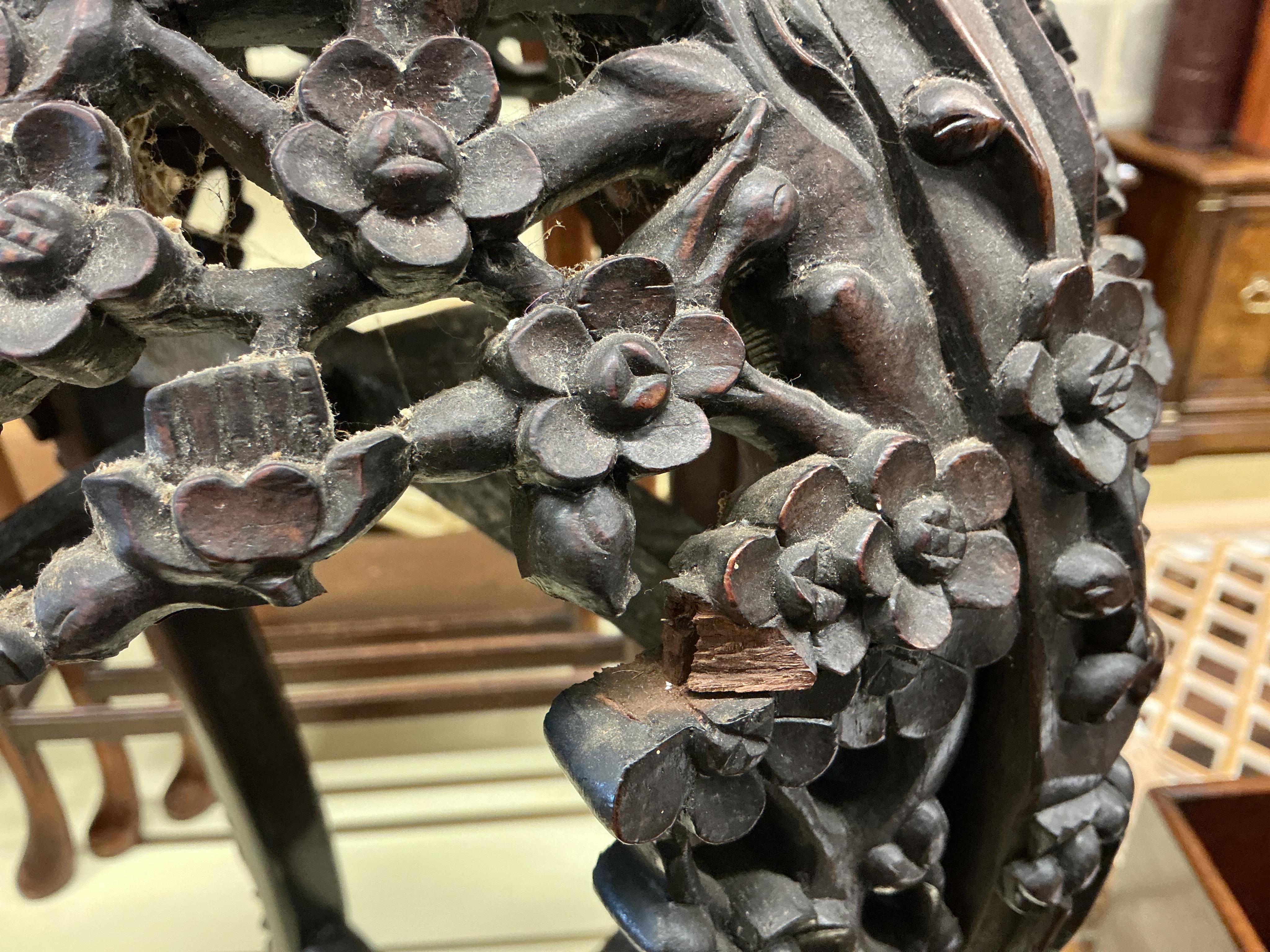 A Chinese carved padouk rouge marble topped jardiniere stand, height 60cm